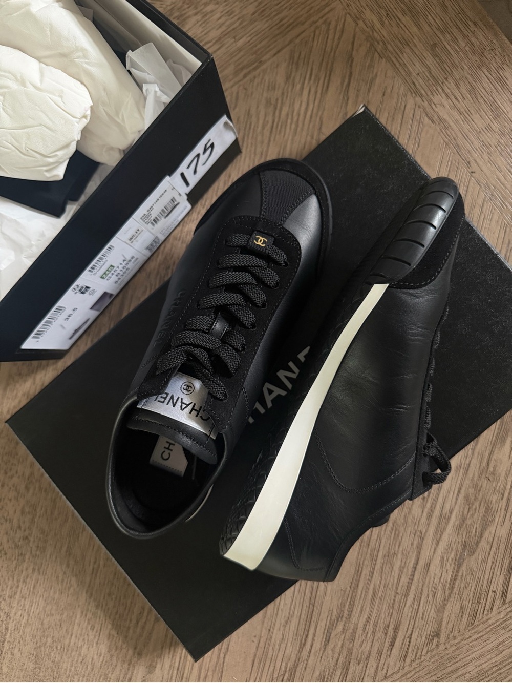 CHANEL Black Leather Low-Top Sneakers with White Midsole Stripe